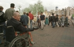 Bedelaar Rolstoel Uitmarkt_JB1996-194-26Nederland,Amsterdam,09-1996↵
project Geld↵
↵
Gehandicapte man in rolstoel bedelen met pet in zijn hand tijdens de uitmarkt.↵
↵
foto Jan Bogaerts